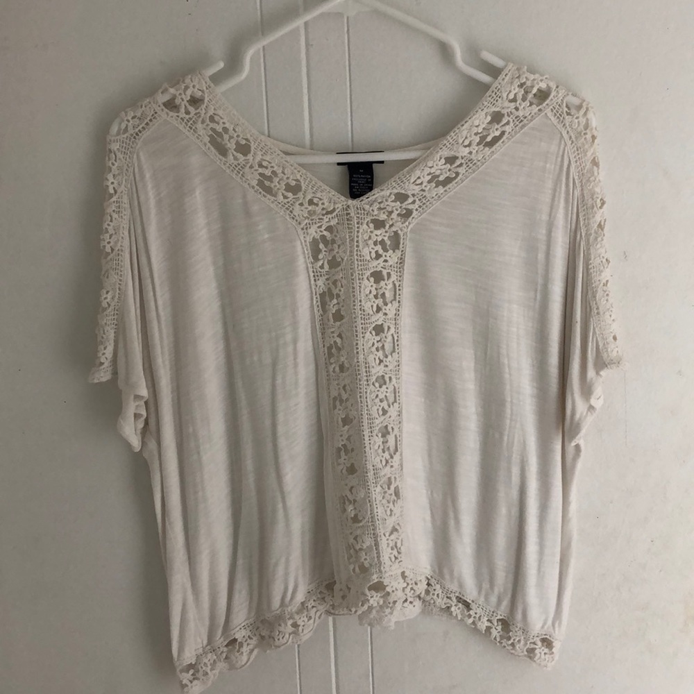 This top has beautiful lace down the front!